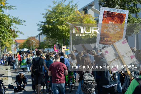 Protesters march during the global climate strike organized by Fridays for Future in Berlin, Germany, on September 20, 2024 