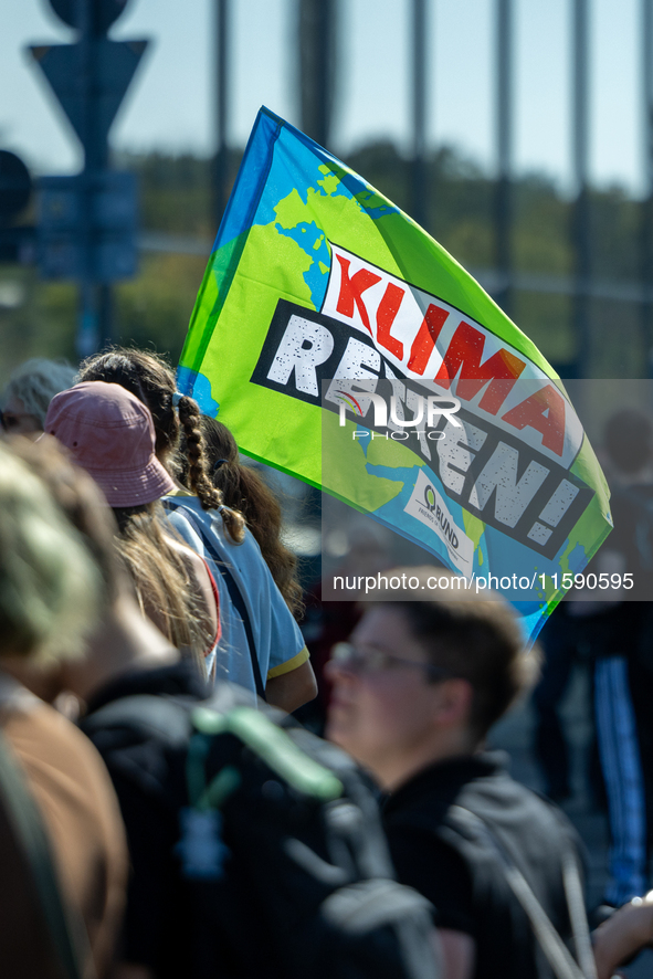 Protesters march during the global climate strike organized by Fridays for Future in Berlin, Germany, on September 20, 2024 