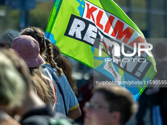 Protesters march during the global climate strike organized by Fridays for Future in Berlin, Germany, on September 20, 2024 (