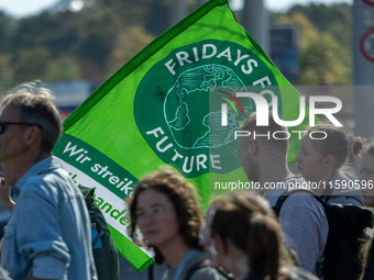 Protesters march during the global climate strike organized by Fridays for Future in Berlin, Germany, on September 20, 2024 (