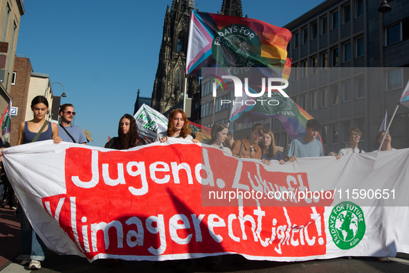 Thousands of people take part in a climate demonstration as part of the Fridays for Future climate action movement in Cologne, Germany, on S...