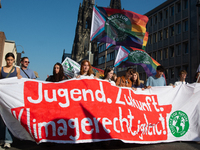 Thousands of people take part in a climate demonstration as part of the Fridays for Future climate action movement in Cologne, Germany, on S...