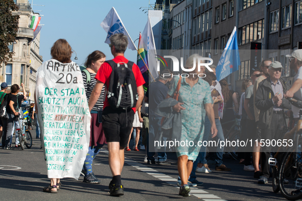 Thousands of people take part in a climate demonstration as part of the Fridays for Future climate action movement in Cologne, Germany, on S...