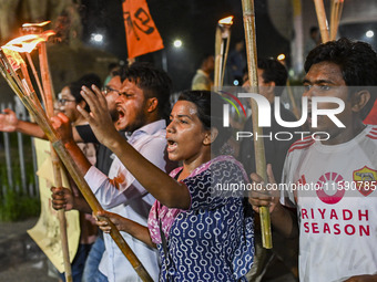 Activists and protesters hold a torch march in Dhaka, Bangladesh, on September 20, 2024. They demand the arrest and trial of those involved...