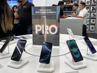 People arrive at an Apple premium reseller store as the iPhone 16 series starts selling in Guwahati, India, on September 20, 2024. (