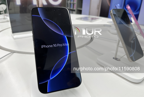 People arrive at an Apple premium reseller store as the iPhone 16 series starts selling in Guwahati, India, on September 20, 2024. 