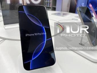 People arrive at an Apple premium reseller store as the iPhone 16 series starts selling in Guwahati, India, on September 20, 2024. (