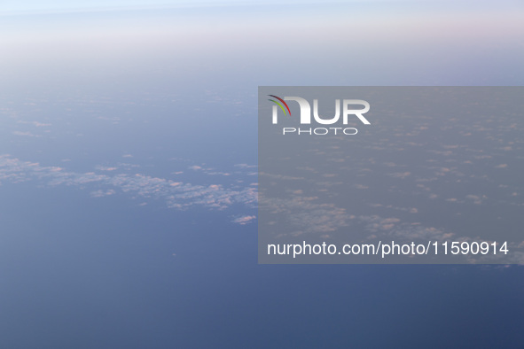 A view of clouds from a plane in Paris, France, on September 15, 2024. Airports Council International (ACI) World releases its latest air tr...