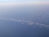 A view of clouds from a plane in Paris, France, on September 15, 2024. Airports Council International (ACI) World releases its latest air tr...