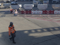 An airport worker stands on land at Orly Airport in Paris, France, on September 15, 2024. Airports Council International (ACI) World release...