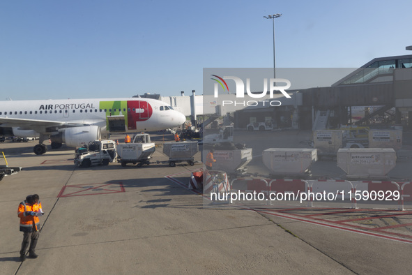 Airport workers are on land at Orly Airport in Paris, France, on September 15, 2024. Airports Council International (ACI) World releases its...