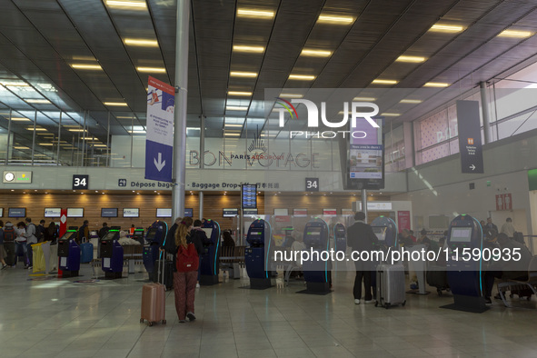 A person rolls a suitcase at Orly Airport in Paris, France, on September 18, 2024. Airports Council International (ACI) World releases its l...