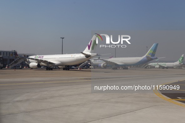 Airplanes from commercial airlines are at Orly Airport in Paris, France, on September 18, 2024. Airports Council International (ACI) World r...