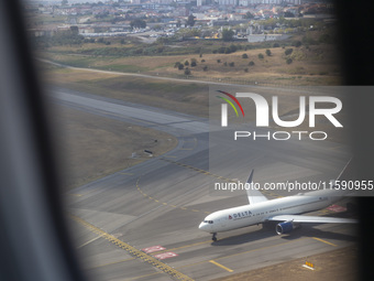 An airplane is seen from another airplane at Lisbon airport in Lisbon, Portugal, on September 18, 2024. Airports Council International (ACI)...