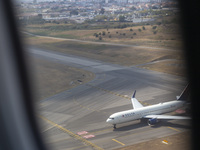 An airplane is seen from another airplane at Lisbon airport in Lisbon, Portugal, on September 18, 2024. Airports Council International (ACI)...