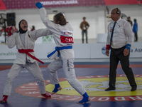 Central Java Jiu-jitsu athlete Tria Novita Sari (Red) competes against female athlete Tiffany Sie from the DKI Jakarta contingent in the Wom...