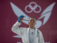 Linda Darrow, an Aceh Jiu Jitsu athlete, competes against Tifanny Sie from the DKI Jakarta contingent in the Fighting System -55 kg women's...