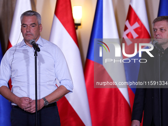 Slovak Prime Minister Robert Fico (R) with Austrian Chancellor Karl Nehammer (L) during a meeting with Polish Prime Minister Donald Tusk, EC...