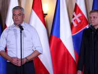 Slovak Prime Minister Robert Fico (R) with Austrian Chancellor Karl Nehammer (L) during a meeting with Polish Prime Minister Donald Tusk, EC...