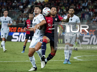 Liberato Cacace (Empoli FC) and Gianluca Lapadula (#9 Cagliari Calcio) during the Serie A TIM match between Cagliari Calcio and Empoli FC in...