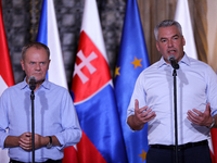 Polish Prime Minister Donald Tusk (L) with Austrian Chancellor Karl Nehammer (R) during a meeting with EC President Ursula von der Leyen, Cz...