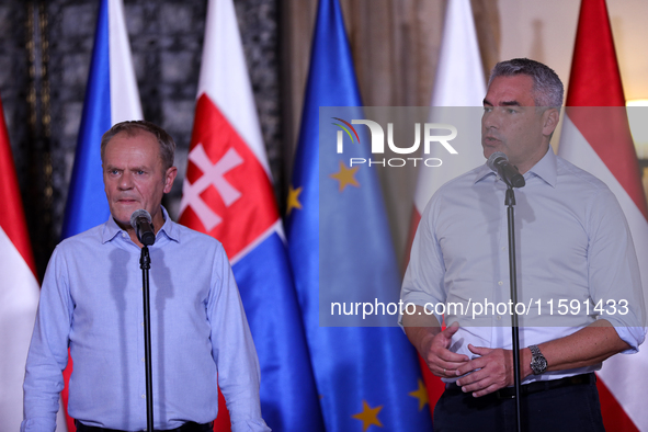 Polish Prime Minister Donald Tusk (L) with Austrian Chancellor Karl Nehammer (R) during a meeting with EC President Ursula von der Leyen, Cz...