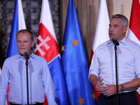 Polish Prime Minister Donald Tusk (L) with Austrian Chancellor Karl Nehammer (R) during a meeting with EC President Ursula von der Leyen, Cz...