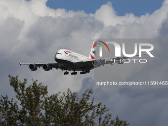 British Airways Airbus A380 Superjumbo passenger aircraft, spotted flying on final approach for landing on London Heathrow Airport runway in...