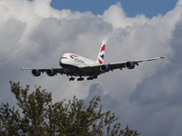 British Airways Airbus A380 Superjumbo passenger aircraft, spotted flying on final approach for landing on London Heathrow Airport runway in...