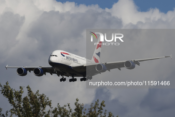 British Airways Airbus A380 Superjumbo passenger aircraft, spotted flying on final approach for landing on London Heathrow Airport runway in...