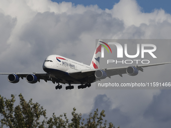 British Airways Airbus A380 Superjumbo passenger aircraft, spotted flying on final approach for landing on London Heathrow Airport runway in...