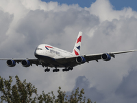 British Airways Airbus A380 Superjumbo passenger aircraft, spotted flying on final approach for landing on London Heathrow Airport runway in...