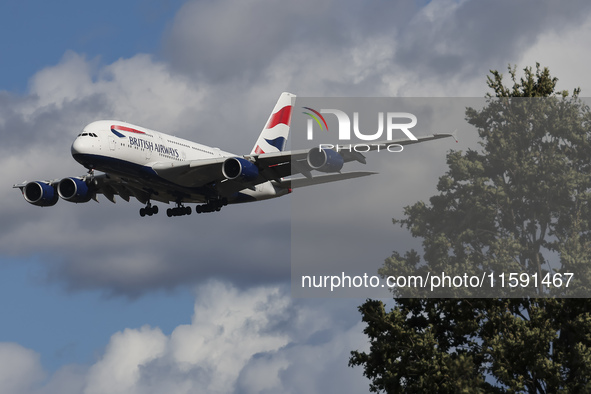 British Airways Airbus A380 Superjumbo passenger aircraft, spotted flying on final approach for landing on London Heathrow Airport runway in...