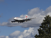 British Airways Airbus A380 Superjumbo passenger aircraft, spotted flying on final approach for landing on London Heathrow Airport runway in...