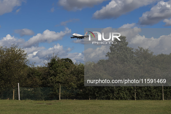 British Airways Airbus A380 Superjumbo passenger aircraft, spotted flying on final approach for landing on London Heathrow Airport runway in...