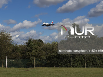 British Airways Airbus A380 Superjumbo passenger aircraft, spotted flying on final approach for landing on London Heathrow Airport runway in...