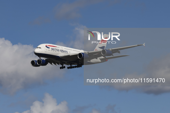 British Airways Airbus A380 Superjumbo passenger aircraft, spotted flying on final approach for landing on London Heathrow Airport runway in...