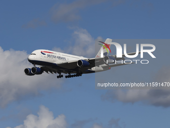 British Airways Airbus A380 Superjumbo passenger aircraft, spotted flying on final approach for landing on London Heathrow Airport runway in...