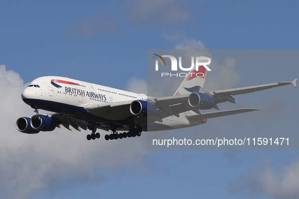 British Airways Airbus A380 Superjumbo passenger aircraft, spotted flying on final approach for landing on London Heathrow Airport runway in...