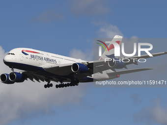 British Airways Airbus A380 Superjumbo passenger aircraft, spotted flying on final approach for landing on London Heathrow Airport runway in...