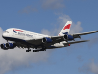 British Airways Airbus A380 Superjumbo passenger aircraft, spotted flying on final approach for landing on London Heathrow Airport runway in...