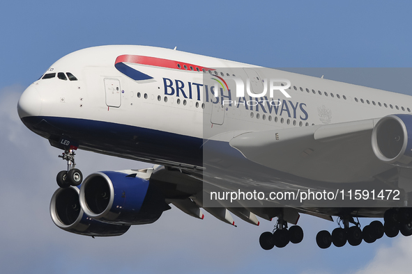 British Airways Airbus A380 Superjumbo passenger aircraft, spotted flying on final approach for landing on London Heathrow Airport runway in...