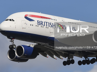 British Airways Airbus A380 Superjumbo passenger aircraft, spotted flying on final approach for landing on London Heathrow Airport runway in...