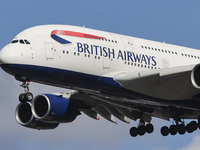 British Airways Airbus A380 Superjumbo passenger aircraft, spotted flying on final approach for landing on London Heathrow Airport runway in...