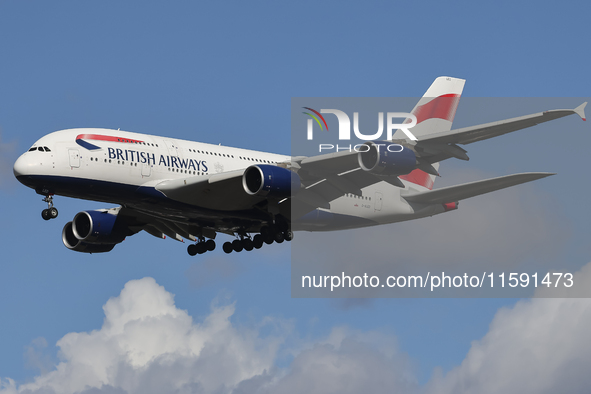 British Airways Airbus A380 Superjumbo passenger aircraft, spotted flying on final approach for landing on London Heathrow Airport runway in...