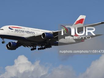 British Airways Airbus A380 Superjumbo passenger aircraft, spotted flying on final approach for landing on London Heathrow Airport runway in...