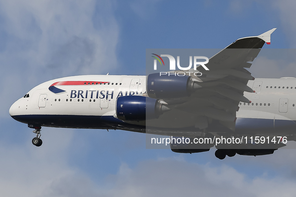 British Airways Airbus A380 Superjumbo passenger aircraft, spotted flying on final approach for landing on London Heathrow Airport runway in...