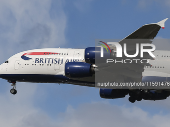 British Airways Airbus A380 Superjumbo passenger aircraft, spotted flying on final approach for landing on London Heathrow Airport runway in...