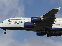 British Airways Airbus A380 Superjumbo passenger aircraft, spotted flying on final approach for landing on London Heathrow Airport runway in...