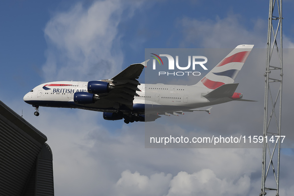 British Airways Airbus A380 Superjumbo passenger aircraft, spotted flying on final approach for landing on London Heathrow Airport runway in...